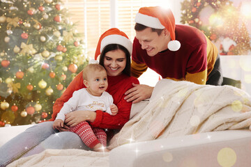 Poster - Happy couple with cute baby on sofa in room decorated for Christmas. Magical festive atmosphere