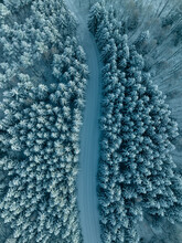 Aerial Overview Of Winter Road Through The Forest In Scandinavia, Sweden