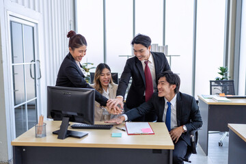 Employee on line reading good news mail from PC screen excited and happy together from their winning