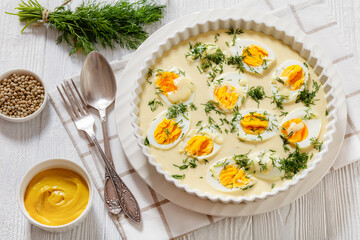 Wall Mural - Senfeier, hard boiled eggs in creamy mustard sauce