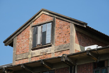 Industrial brick building against blue sky