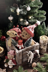 Wall Mural - Christmas still life with old teddy bears in wooden box on the table in rustic style with faded colors