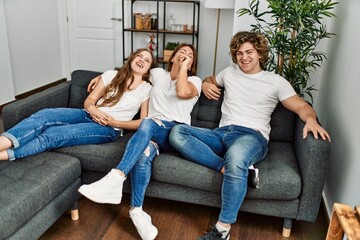 Canvas Print - Mother and couple smiling confident hugging each other at home