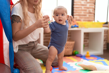 Poster - Teacher and preschool student standing with relaxed expression at kindergarten