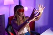 © Krakenimages.com - African american woman streamer playing video game using virtual reality glasses at gaming room