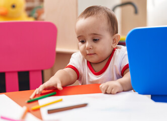 Canvas Print - Adorable hispanic baby preschool student holding pencil color standing at kindergarten