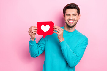 Sticker - Photo of satisfied glad toothy beaming smile brunet hair guy hold red paper like symbol popular blogger promo isolated on pink color background