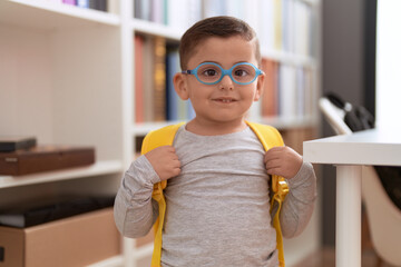 Poster - Adorable hispanic toddler student smiling confident standing at library school