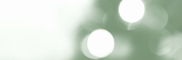 Wall Mural - Blurred lights, green background, banner texture. Abstract bokeh with soft light header. Wide screen wallpaper. Panoramic web banner with copy space for design