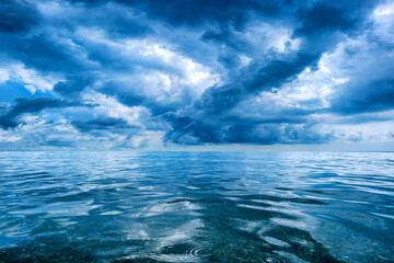 Poster - gloomy sky with clouds and sea. blue tinted