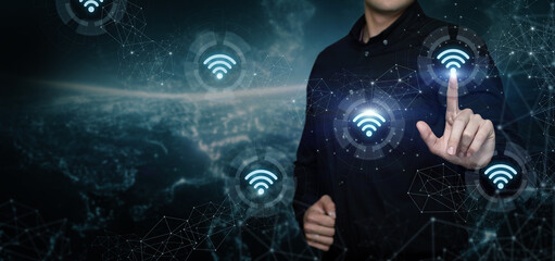 Wall Mural - A businessman works in a wireless communication network .