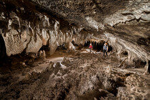 Researchers Exploring Stalagmites In A Cave In Gunung Mulu National Park; Sarawak, Borneo, Malaysia