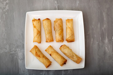 Poster - Spring Roll also known as Egg Roll on white dish