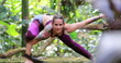 Athletic yogi woman training asana Yoga pose outdoors in the nature