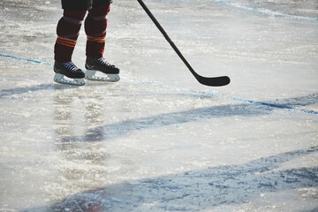 Person in ice hockey outfit on the ice