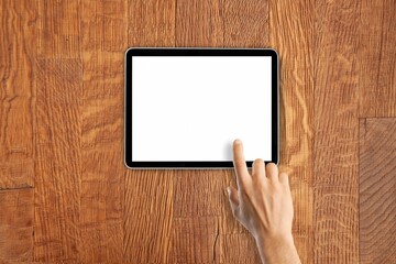 Hand hold a digital tablet with a blank screen