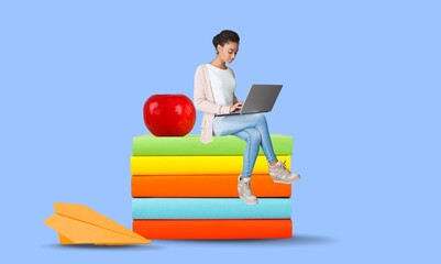 Wall Mural - Person study and sitting on big book