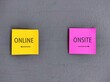 © ariya j - Yellow and pink stick note on wall with direction to ONLINE and ONSITE, education and work choices in pandemic, digital revolution turned conventional working and studying onsite to online or hybrid