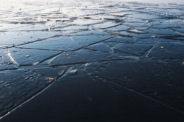 Fragments of ice froze on the surface of the lake.