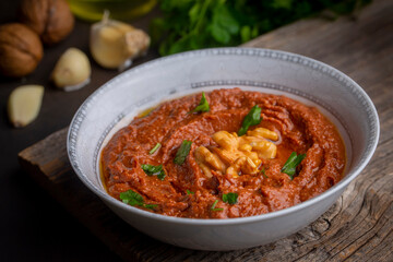 Wall Mural - Traditional delicious Turkish appetizer, Muhammara, healthy walnut and roasted red bell pepper dip