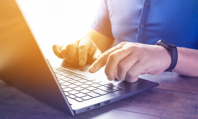 Poster - Close up of person hand typing on laptop keyboard, author writing on notebook computer, businessman programmer working concept. Freelancer copywriter working project, typing text, edit