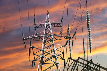 Wall Mural - Electricity pylon (high voltage power line) against the background of a romantic evening sky