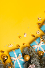 Wall Mural - christmas background with pine tree, gifts and festive decorations top view. xmas flat lay. copy spa