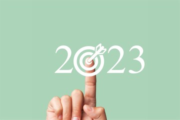 Wall Mural - Hand touch target in 2023 numbers