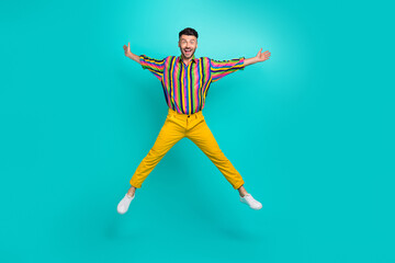 Wall Mural - Full length photo of young jumping air ovejoyed man wear retro sweater like his star symbol shopaholic sale isolated on aquamarine color background