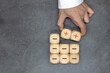 Plus and minus icons on wooden cubes. Separate the negative from positive, removing the weaknesses or negativity, positive thinking, negative feedback or subtraction.