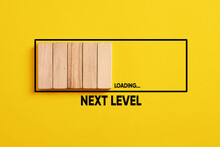 Development, Improvement. Completing A Task And Moving Forward To The Next Level. Next Level Loading Bar On Yellow Background.