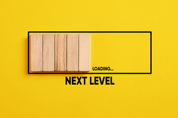 Development, improvement. Completing a task and moving forward to the next level. Next level loading bar on yellow background.