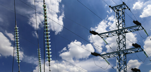 Wall Mural - Electricity pylon (high voltage power line) on the background of the cloudy sky