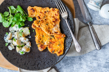 Canvas Print - Lemon and thyme pork schnitzel with potato salad