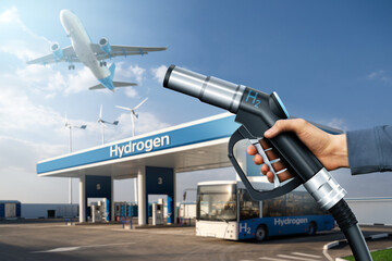 Hand with H2 nozzle on a background of fuel cell bus at the hydrogen filling station and airplane in the sky. Clean mobility concept	