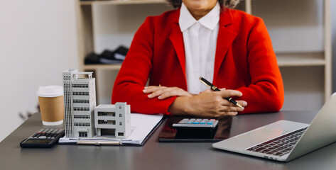 businesswoman hand working with laptop computer, tablet and smart phone in modern office with virtual icon diagram at modernoffice in morning light