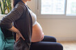 Pregnant woman feeling labor contractions