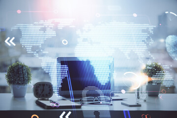 Poster - Double exposure of desktop with computer and world map hologram. International data network concept.
