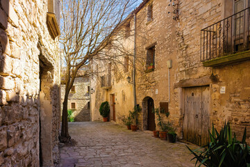 Wall Mural - Street in the walled historic center of Montfalcó Murallat, Catalonia, Spain