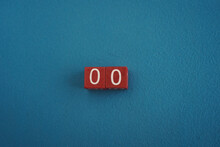Wooden Viva Magenta Cubes With Number 00 Blue Background Close-up Top View. Concept Of Date Time. White Numbers 0 On Red Cubes Velvet Background. Copy Space Text. Selective Focus, Blurred Background