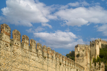 Wall Mural - Detail of the fortified walls with crenellated towers of the medieval Scaliger Castle of Soave, Verona, Veneto, Italy