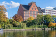 Spree river embankment  Holsteiner Ufer with buildings of a  Gymnasium school in Berlin, Germany