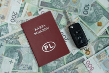Vehicle Licence Card In Poland, Car Keys And Złoty Money, PLN Zloty Banknotes. Letters In Polish Language, Karta Pojazdu Means Registration Certificate Card. Buying A Car Or Insurance Concept.