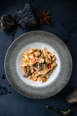 Poster - Italian lunch pasta with beef, tomatoes, mushrooms, cream sauce and green onions.