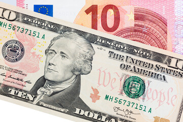 Wall Mural - One ten dollar bill on a ten euro banknote Isolate on white.  Ideal content for creating business concepts, economic and financial news.