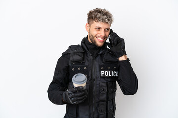 Poster - SWAT caucasian man isolated on white background holding coffee to take away and a mobile