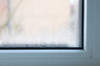 Close up of double glazed window  condensation causes by excessive moisture in the house in winter occurs when the seal between panes is broken or desiccant inside the window.