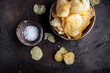 Leinwandbild Motiv Crispy potato chips with salt