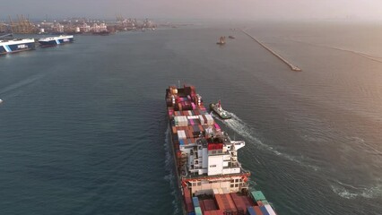 Wall Mural - Aerial view of smart cargo ship carrying container in ocean.