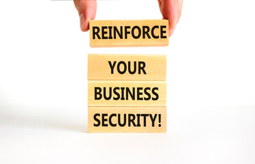 Wall Mural - Reinforce your business security symbol. Concept word Reinforce your business security on blocks. Beautiful white table white background. Business reinforce your business security concept. Copy space.